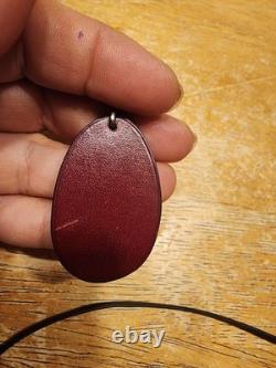 Vintage Hermès leather plum fruit bag charm and keychain featuring burgundy box